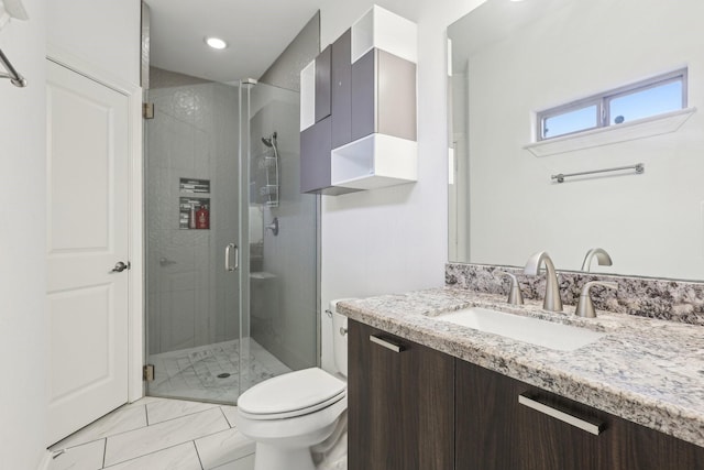 bathroom with vanity, recessed lighting, toilet, a shower stall, and marble finish floor