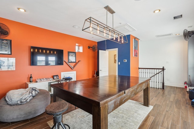 office area with baseboards, recessed lighting, attic access, and wood finished floors