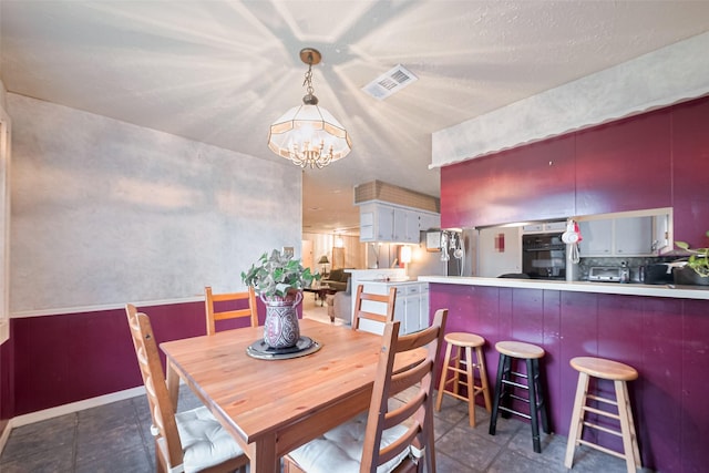 5622 Sheraton Oaks Dr, Houston, TX 77091 - dining space with a chandelier and baseboards