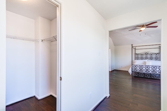7215 Autumn Day Ct, Magnolia, TX 77354 - unfurnished bedroom featuring baseboards, vaulted ceiling, wood finished floors, and ceiling fan