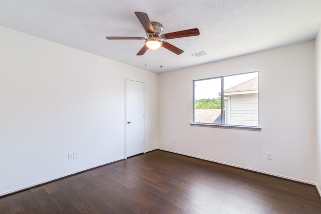 7215 Autumn Day Ct, Magnolia, TX 77354 - empty room with baseboards, visible vents, ceiling fan, and dark wood finished floors