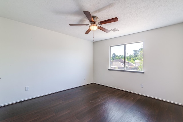 7215 Autumn Day Ct, Magnolia, TX 77354 - unfurnished room with a ceiling fan, visible vents, and dark wood finished floors
