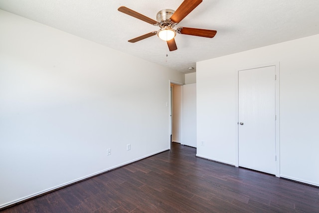7215 Autumn Day Ct, Magnolia, TX 77354 - unfurnished bedroom featuring dark wood-type flooring, baseboards, and ceiling fan