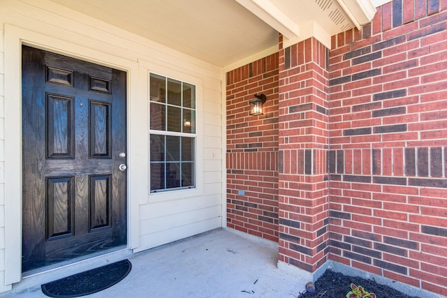 7215 Autumn Day Ct, Magnolia, TX 77354 - entrance to property featuring brick siding and covered porch