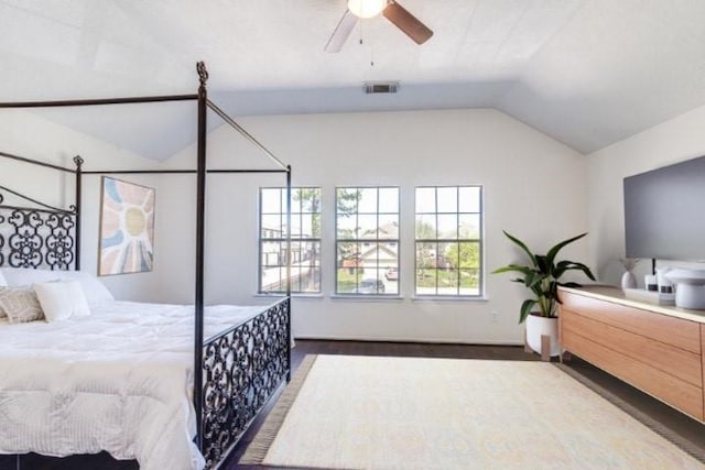 7215 Autumn Day Ct, Magnolia, TX 77354 - bedroom featuring ceiling fan, vaulted ceiling, wood finished floors, and visible vents