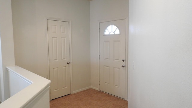 entrance foyer with light tile patterned floors