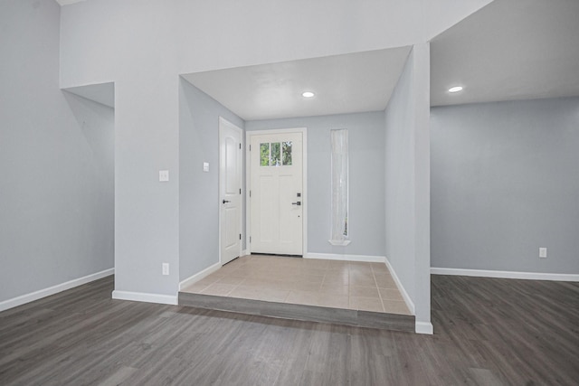 foyer with wood finished floors, recessed lighting, and baseboards