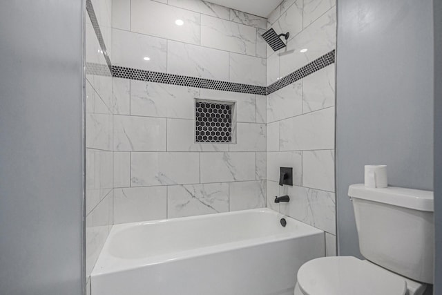 bathroom with toilet and bathtub / shower combination
