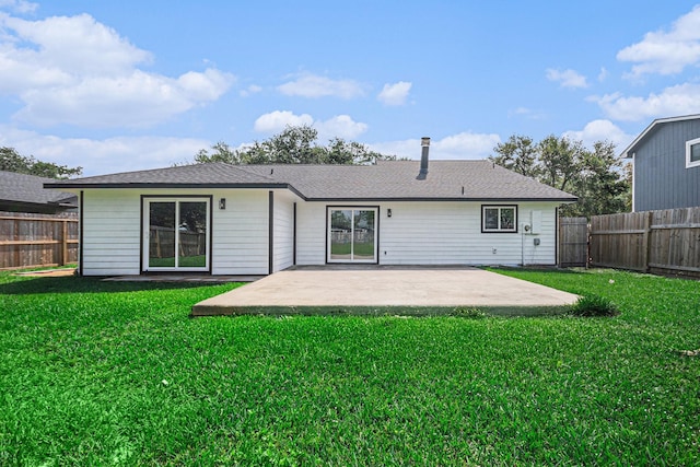 rear view of property featuring a patio, a fenced backyard, and a lawn