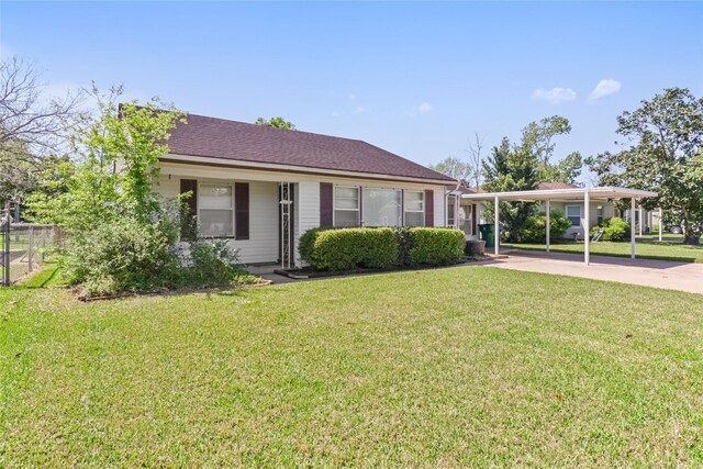 1220 San Felipe St, Angleton, TX 77515 - view of front of home featuring a front yard, driveway, and a shingled roof