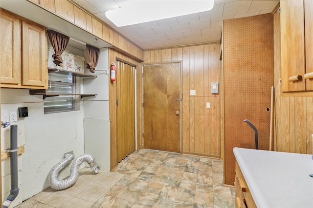 1220 San Felipe St, Angleton, TX 77515 - laundry room featuring wooden walls and cabinet space