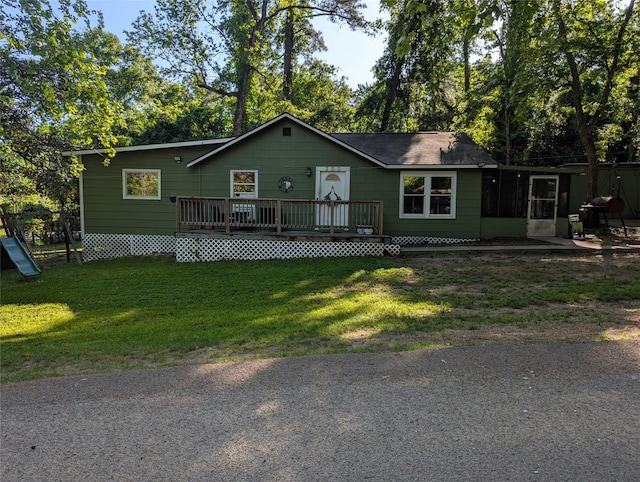 200 Commanche Rd, Conroe, TX 77316 - view of front of house with a wooden deck and a front lawn