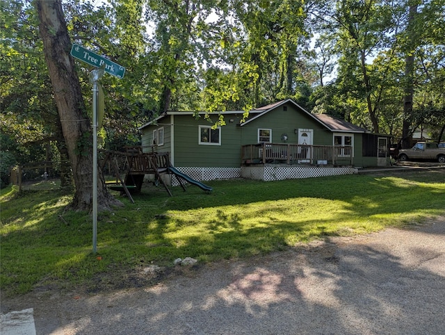 200 Commanche Rd, Conroe, TX 77316 - rear view of property featuring a wooden deck and a lawn