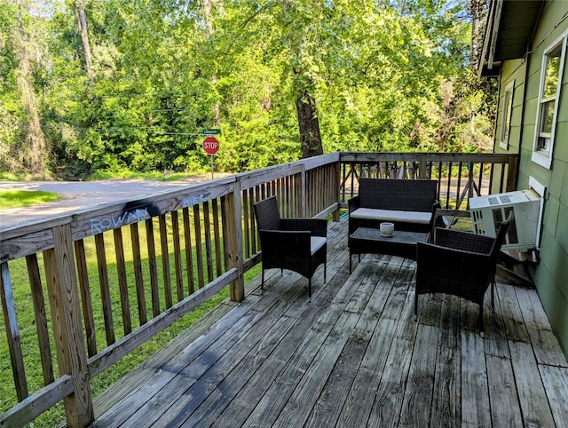 200 Commanche Rd, Conroe, TX 77316 - wooden terrace with outdoor lounge area and a view of trees