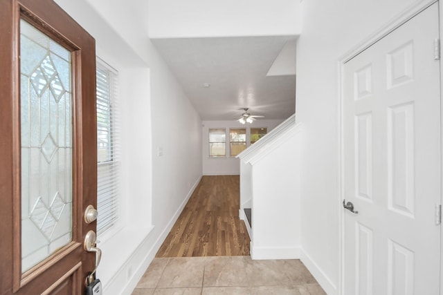 6 Whitekirk Pl, Magnolia, TX 77354 - foyer entrance featuring light wood-type flooring, baseboards, and a ceiling fan