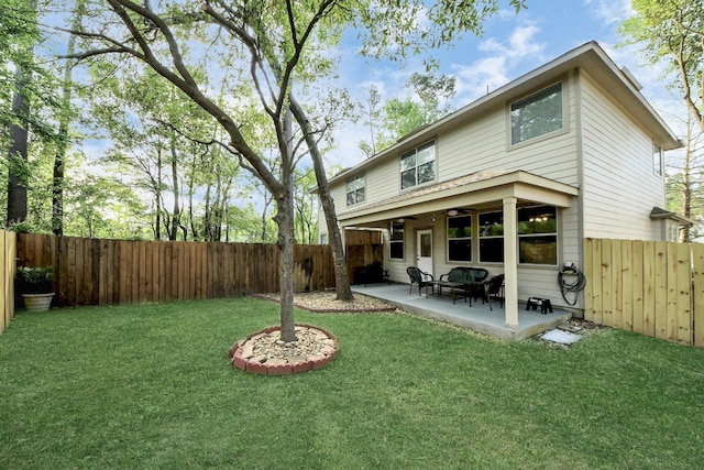 6 Whitekirk Pl, Magnolia, TX 77354 - back of property with a patio, a yard, a fenced backyard, and a ceiling fan