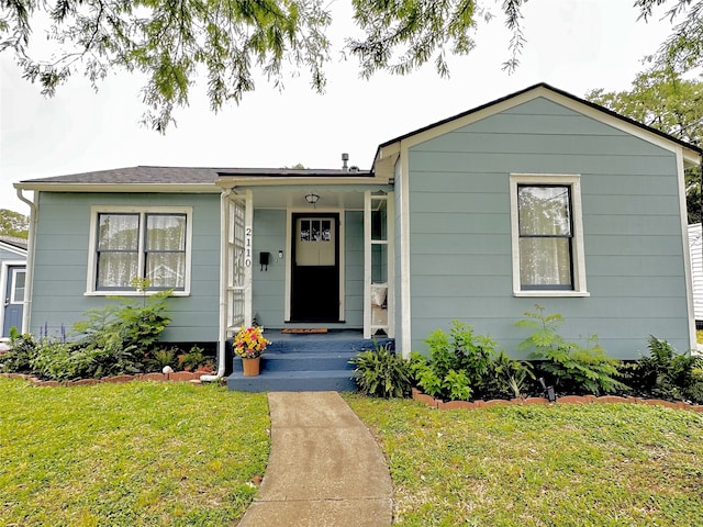 view of front of home with a front yard