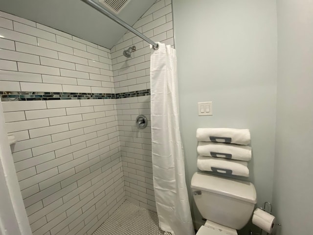 bathroom featuring a shower stall, visible vents, and toilet