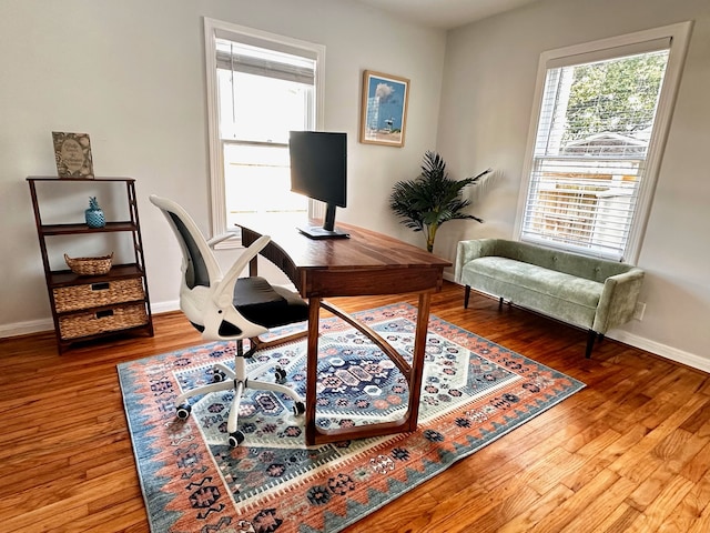 office space featuring wood finished floors and baseboards