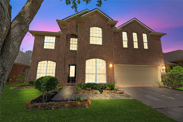 traditional-style house with brick siding, a front lawn, and driveway