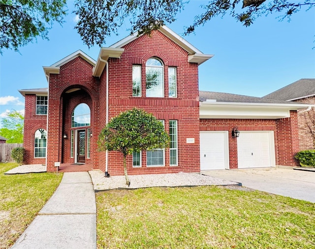 traditional-style home with concrete driveway, brick siding, an attached garage, and a front lawn