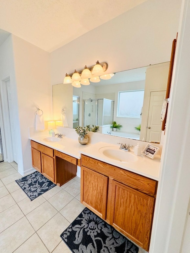 bathroom with a shower stall, tile patterned flooring, and vanity