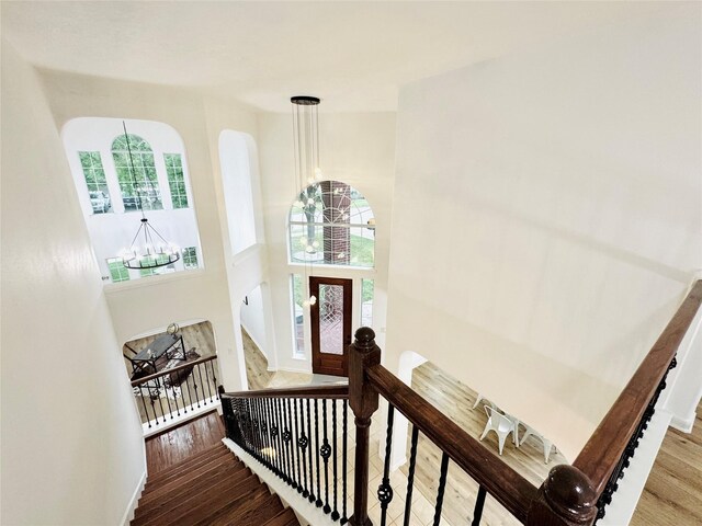 entryway with a chandelier and wood finished floors