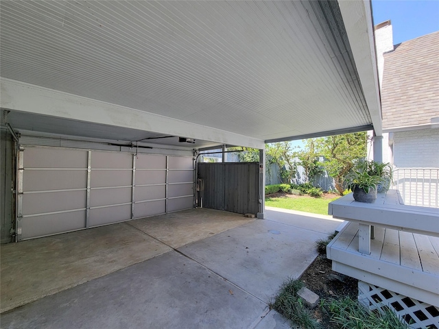 garage with a carport and a garage door opener