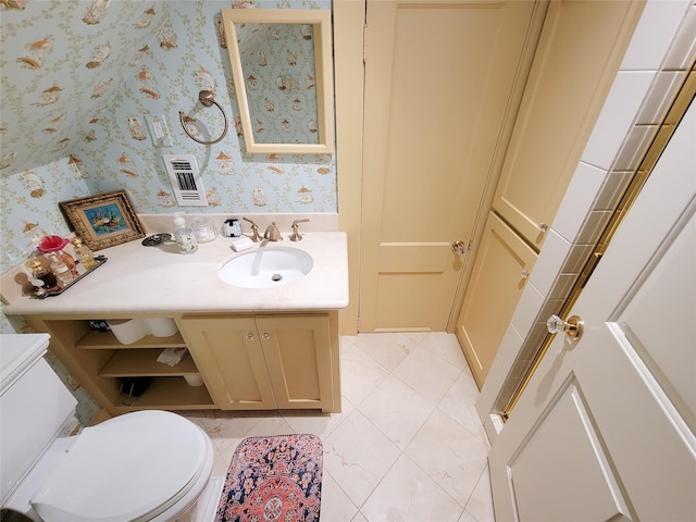 bathroom featuring tile patterned floors, vanity, wallpapered walls, and toilet