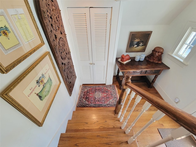 interior space with baseboards and wood finished floors