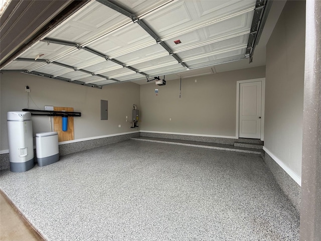 garage featuring baseboards, a garage door opener, water heater, and electric panel