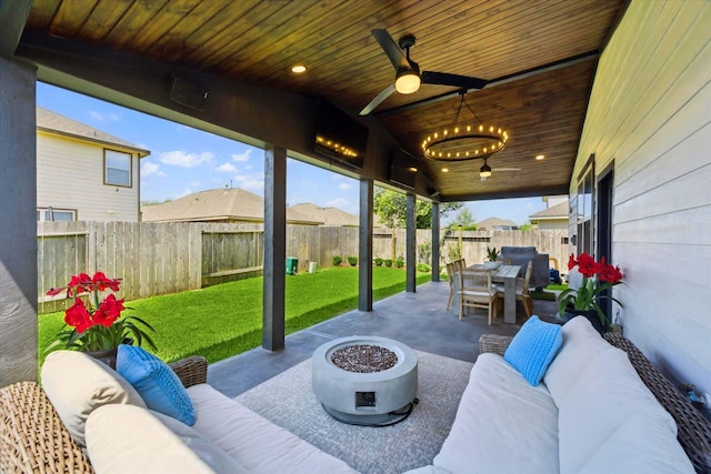 view of patio / terrace with an outdoor hangout area, a ceiling fan, and outdoor dining space