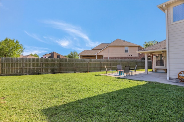 view of yard featuring a patio and a fenced backyard