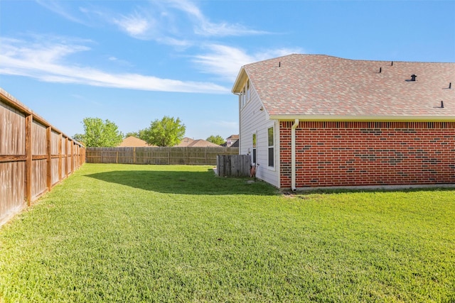 view of yard with a fenced backyard
