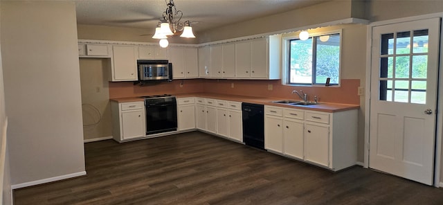 520 Walnut St, Waller, TX 77484 - kitchen with stainless steel microwave, dishwasher, white cabinetry, stove, and a sink