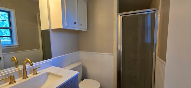 520 Walnut St, Waller, TX 77484 - bathroom featuring toilet, wainscoting, a stall shower, and vanity