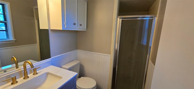 520 Walnut St, Waller, TX 77484 - bathroom with vanity, a stall shower, toilet, a wainscoted wall, and wood walls
