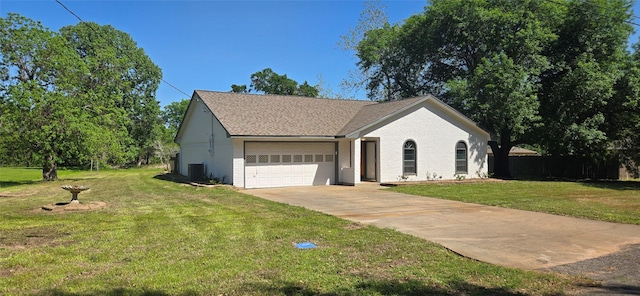 520 Walnut St, Waller, TX 77484 - ranch-style house with a front yard, brick siding, driveway, and an attached garage