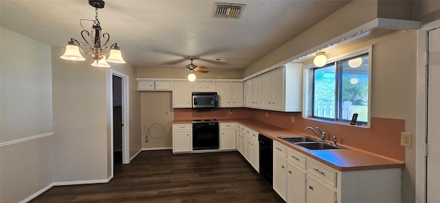 520 Walnut St, Waller, TX 77484 - kitchen with visible vents, a sink, stainless steel microwave, stove, and dark wood-type flooring