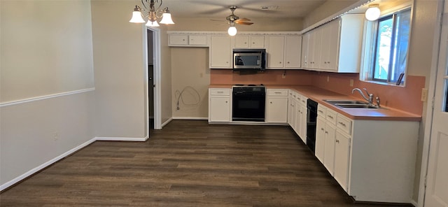 520 Walnut St, Waller, TX 77484 - kitchen with stainless steel microwave, white cabinetry, dishwasher, and stove