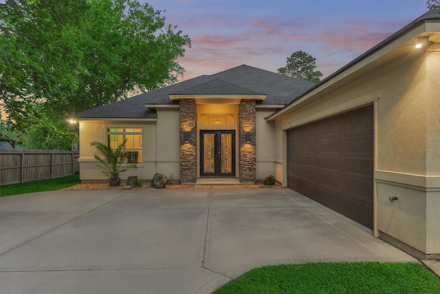 12122 Hawthorne Dr, Montgomery, TX 77356 - view of front of property with french doors, stone siding, stucco siding, concrete driveway, and a shingled roof