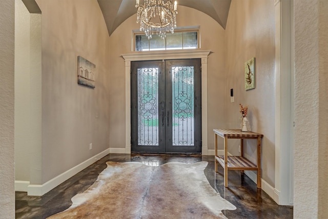 12122 Hawthorne Dr, Montgomery, TX 77356 - foyer entrance featuring french doors, a chandelier, arched walkways, and vaulted ceiling