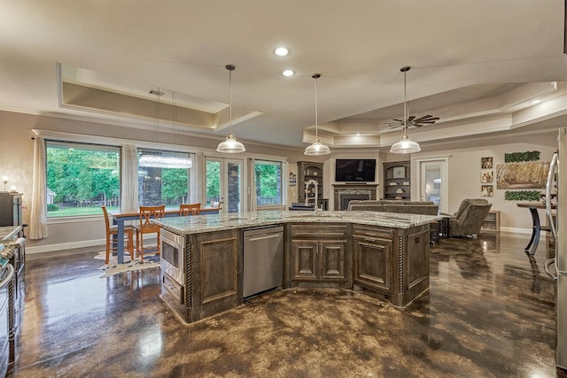 12122 Hawthorne Dr, Montgomery, TX 77356 - kitchen featuring a tray ceiling, stainless steel appliances, finished concrete floors, dark brown cabinets, and crown molding