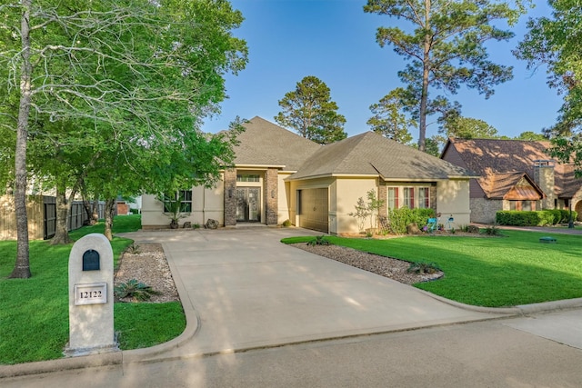 12122 Hawthorne Dr, Montgomery, TX 77356 - view of front of house with driveway, an attached garage, roof with shingles, stucco siding, and brick siding