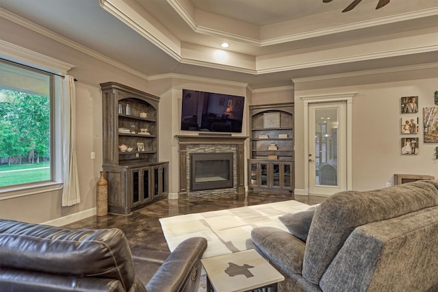 12122 Hawthorne Dr, Montgomery, TX 77356 - living area featuring crown molding, a fireplace, a ceiling fan, and a raised ceiling