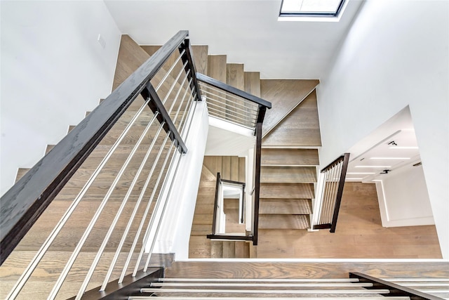 stairs featuring a high ceiling
