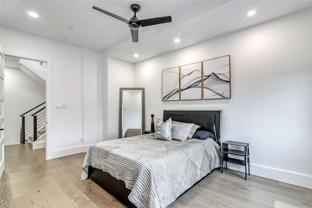 bedroom featuring recessed lighting, light wood finished floors, and baseboards