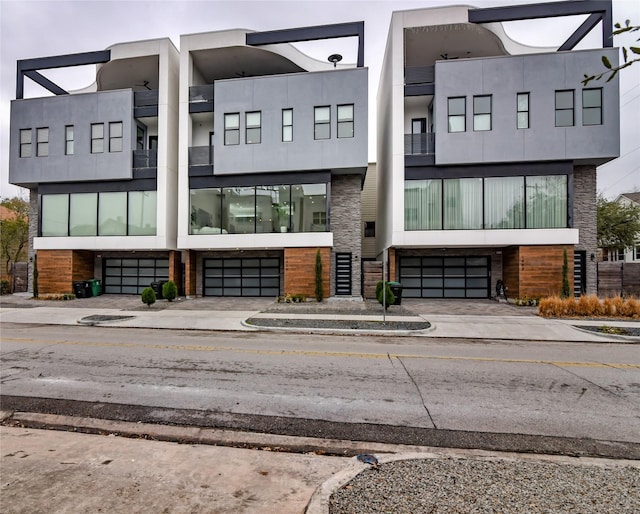 exterior space featuring concrete driveway and a garage