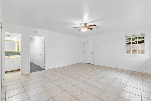 1035 Forestburg Dr, Houston, TX 77038 - unfurnished room featuring ceiling fan and light tile patterned floors