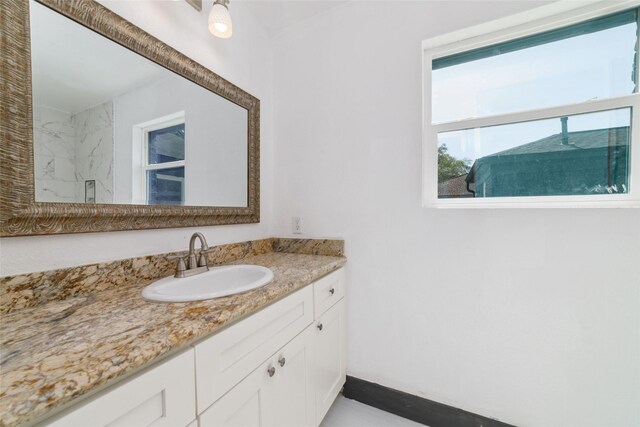 bathroom featuring vanity and walk in shower